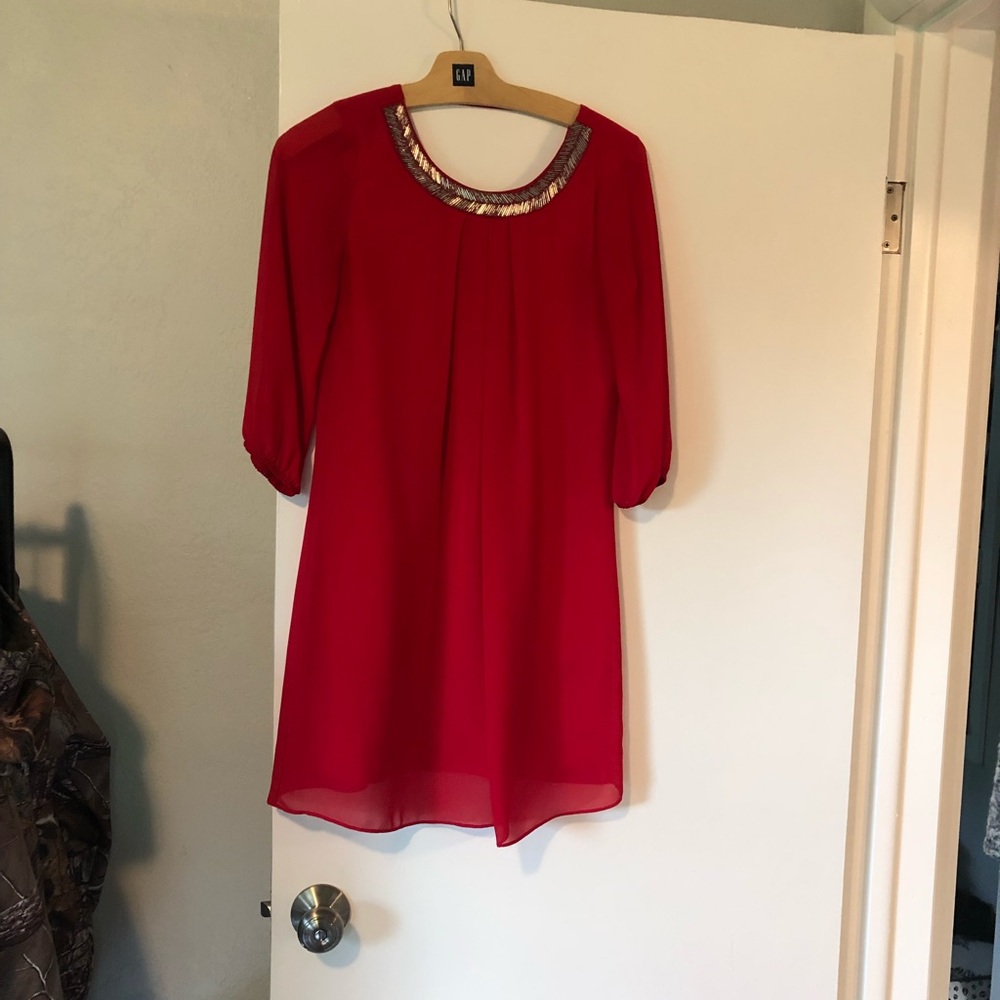 Red dress with gold beading and a cute out back